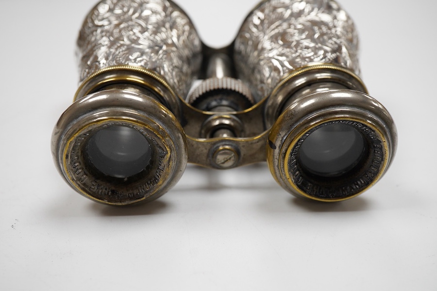 A pair of late Victorian repousse silver mounted plated brass opera glasses, Henry Charles Kelly, Birmingham, 1900, 8.8cm by 11.6cm.
